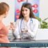 Pregnant woman consulting with doctor while reviewing blood sugar levels, highlighting concerns of maternal diabetes and autism risk