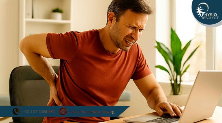 “Man experiencing back bone pain while working on a laptop, seated in a home office with poor posture and visible discomfort.”