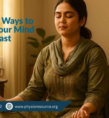Pakistani individual seated cross-legged on the floor in a meditative posture with eyes closed and hands resting on knees. The indoor setting is warm and peaceful, with soft lighting, a potted plant, and curtain in the background.