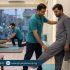 Physiotherapist guiding a patient in a Lahore clinic with calf stretching and ankle mobility to help prevent leg cramps during fasting