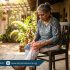 Elderly person experiencing joint pain and weakness in hot summer weather, holding knee with discomfort, Physio Resource Lahore