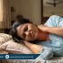 Woman experiencing neck pain after sleeping with wrong pillow and poor posture in hot weather, holding stiff neck with discomfort, Physio Resource Lahore
