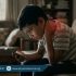 Child using mobile phone and gaming device with poor posture, slouched back and forward neck causing neck and back pain, Physio Resource Lahore