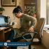 Person experiencing pelvic and hip pain in hot weather, holding lower back and hip area with discomfort, highlighting inflammation and stiffness, Physio Resource Lahore