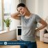 Person experiencing muscle stiffness and neck pain during humid weather, stretching indoors with visible discomfort, Physio Resource