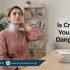 Pakistani adult gently cracking neck with slight discomfort in home or office setting – Physio Resource