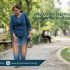 Pakistani adult walking with discomfort and heavy legs feeling in a modern home or outdoor setting – Physio Resource