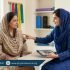 Pakistani woman discussing dry needling treatment with a physiotherapist in a modern clinic – Physio Resource