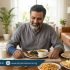 Pakistani adult enjoying a nutritious meal during recovery after a bone fracture – Physio Resource