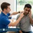 Male physiotherapist assessing a patient with migraine or neck-related headache