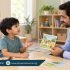 Male speech therapist using a picture card to engage a young boy in conversation while his mother watches.